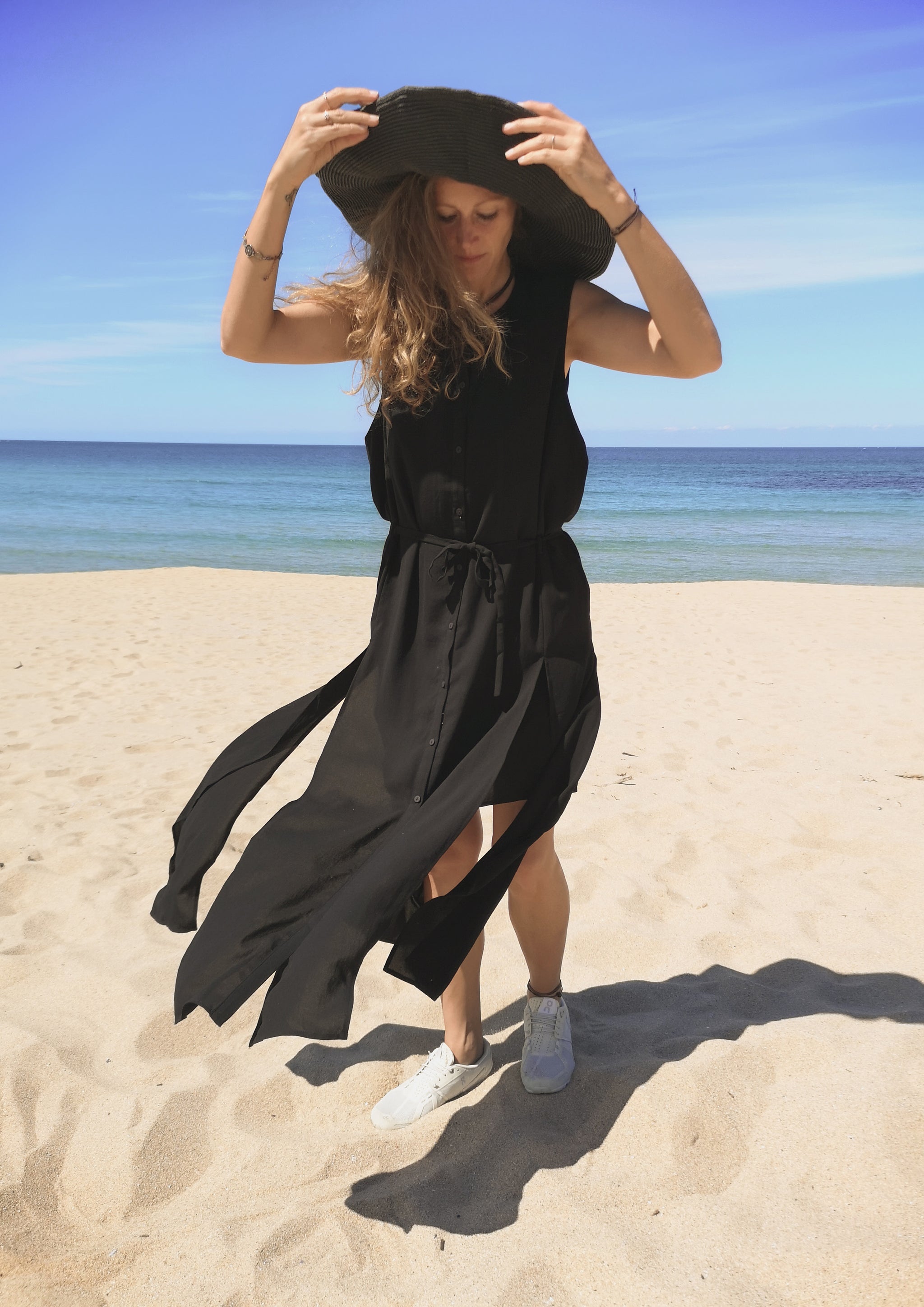 Long black sleeveless hot sale vest