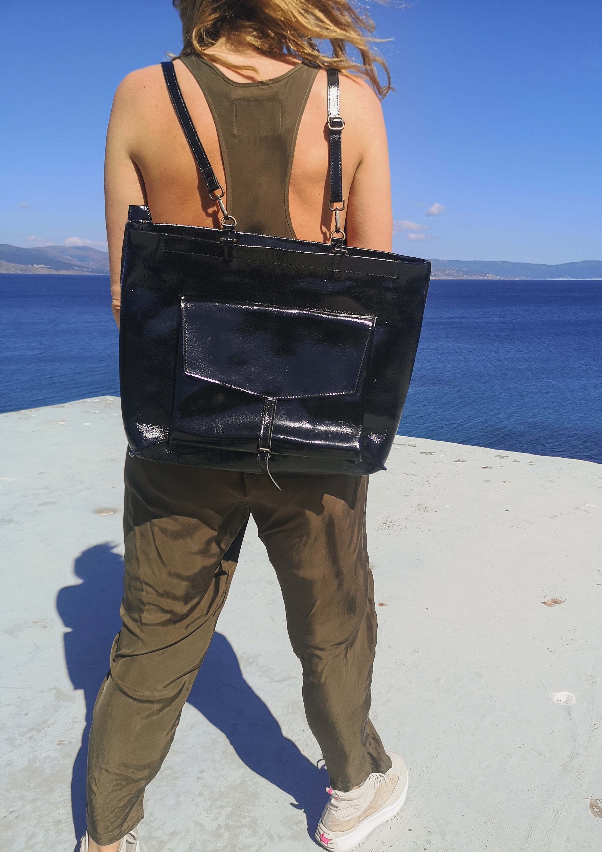 Black patent leather backpack top